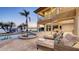 A backyard pool and patio area with luxurious lounge seating, perfect for relaxation and entertaining at 7342 Captain Kidd Ave, Sarasota, FL 34231