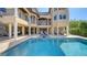A large backyard pool on a multi-story house, perfect for outdoor relaxation and entertaining at 7342 Captain Kidd Ave, Sarasota, FL 34231