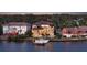 Waterfront home featuring a private dock, lush backyard, and outdoor living spaces at 7342 Captain Kidd Ave, Sarasota, FL 34231