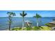 An expansive waterfront view reveals a boat dock and tranquil blue waters at 7342 Captain Kidd Ave, Sarasota, FL 34231