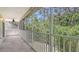 Covered balcony provides a serene outdoor space surrounded by trees at 7632 Marsh Orchid Cir # 7632, Bradenton, FL 34203