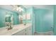 Bathroom features a double sink vanity, framed mirror and bright, coordinating walls at 7632 Marsh Orchid Cir # 7632, Bradenton, FL 34203