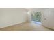 Bright bedroom with sliding door to the balcony and neutral carpet at 7632 Marsh Orchid Cir # 7632, Bradenton, FL 34203