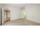Bright bedroom with neutral carpet, bathroom access, and doors to living area at 7632 Marsh Orchid Cir # 7632, Bradenton, FL 34203