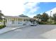Charming clubhouse exterior with a golf cart parked outside, inviting community space at 7632 Marsh Orchid Cir # 7632, Bradenton, FL 34203