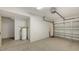 Garage featuring an updated floor and water heater, ready for your vehicles and extra storage space at 7632 Marsh Orchid Cir # 7632, Bradenton, FL 34203