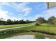 Scenic view of the lush green golf course under a clear sky, a golfer's paradise at 7632 Marsh Orchid Cir # 7632, Bradenton, FL 34203