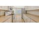 Bright kitchen featuring tiled floors, and ample white cabinets and appliances at 7632 Marsh Orchid Cir # 7632, Bradenton, FL 34203