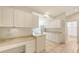 Bright kitchen featuring tiled floors, and ample white cabinets at 7632 Marsh Orchid Cir # 7632, Bradenton, FL 34203