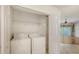 Convenient laundry room features a washer and dryer, with easy access to the main living area at 7632 Marsh Orchid Cir # 7632, Bradenton, FL 34203