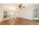 Open living area showcases hardwood floors and an adjacent kitchen with tile flooring at 7632 Marsh Orchid Cir # 7632, Bradenton, FL 34203