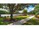 Well-maintained tennis courts surrounded by landscaping, offering a great recreational amenity at 7632 Marsh Orchid Cir # 7632, Bradenton, FL 34203