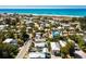 A beautiful aerial view showcases this property's proximity to the Gulf Coast beaches and clear blue water at 811 Jacaranda Rd, Anna Maria, FL 34216