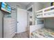 Comfortable bedroom features light blue walls, a bunk bed, and coastal decor at 811 Jacaranda Rd, Anna Maria, FL 34216