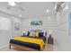 Serene bedroom retreat with wood-look floors, nautical decor, and comfortable queen bed offers a relaxing getaway at 811 Jacaranda Rd, Anna Maria, FL 34216