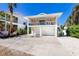 Charming stilt home with a spacious deck and ample covered parking at 811 Jacaranda Rd, Anna Maria, FL 34216