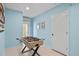 Fun game room featuring a foosball table and light blue walls at 811 Jacaranda Rd, Anna Maria, FL 34216