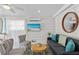 Inviting living room with modern furniture, a ceiling fan, and a flatscreen TV for entertainment at 811 Jacaranda Rd, Anna Maria, FL 34216