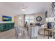 Cozy living room with comfortable seating, a TV, and ample natural light at 811 Jacaranda Rd, Anna Maria, FL 34216