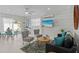 Comfortable living room featuring shiplap walls and easy access to the outdoor spaces at 811 Jacaranda Rd, Anna Maria, FL 34216