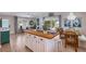 Open floorplan with a breakfast bar connecting the kitchen to the living room at 811 Jacaranda Rd, Anna Maria, FL 34216