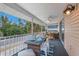 Relaxing outdoor patio with a dining table and comfortable seating at 811 Jacaranda Rd, Anna Maria, FL 34216