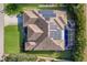 Aerial view of a home featuring a pool, solar panels, and well-maintained landscaping at 8314 9Th Avenue Nw Ter, Bradenton, FL 34209