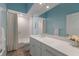 Bathroom with a white vanity, a large mirror, and a shower-tub combination with a white tile surround at 8314 9Th Avenue Nw Ter, Bradenton, FL 34209