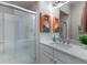 Contemporary bathroom with a glass-enclosed shower and a modern vanity with stylish fixtures at 8314 9Th Avenue Nw Ter, Bradenton, FL 34209