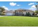 Inviting home with a well-manicured lawn, a two-car garage and an elegant arched entryway at 8314 9Th Avenue Nw Ter, Bradenton, FL 34209