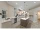 Spacious kitchen features stainless appliances, sleek cabinets, large island, and opens to the living area at 8314 9Th Avenue Nw Ter, Bradenton, FL 34209