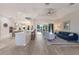 Spacious open living area featuring a modern kitchen, breakfast bar, and comfortable seating at 8314 9Th Avenue Nw Ter, Bradenton, FL 34209