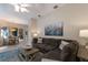 Cozy living room featuring a large sectional sofa and an adjacent dining area with a wooden table and chairs at 8314 9Th Avenue Nw Ter, Bradenton, FL 34209