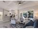 Open-concept living area with a kitchen, breakfast bar, comfortable seating, and access to an outdoor space at 8314 9Th Avenue Nw Ter, Bradenton, FL 34209