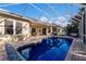 Inviting pool and patio area with grill, dining, and lounge space for outdoor enjoyment at 8314 9Th Avenue Nw Ter, Bradenton, FL 34209