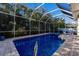 Enclosed pool with brick patio and lush landscaping for ultimate relaxation and privacy at 8314 9Th Avenue Nw Ter, Bradenton, FL 34209