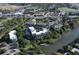 Stunning aerial view of condo community surrounded by lush trees and waterfront views at 835 S Osprey Ave # 310, Sarasota, FL 34236