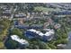 Expansive aerial view of community condos, a pool, and beautiful landscaping near the water at 835 S Osprey Ave # 310, Sarasota, FL 34236