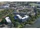 Scenic aerial view of waterfront condos featuring lush landscaping and a swimming pool at 835 S Osprey Ave # 310, Sarasota, FL 34236