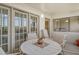Charming balcony with outdoor seating and screened doors offering a relaxing space at 835 S Osprey Ave # 310, Sarasota, FL 34236