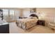 Well-lit bedroom with a desk, balcony access, and a calm, neutral color scheme at 835 S Osprey Ave # 310, Sarasota, FL 34236