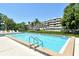 Sparkling community pool, perfectly sized for exercise and relaxation with comfortable lounge seating at 835 S Osprey Ave # 310, Sarasota, FL 34236