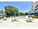 Relaxing pool area with comfortable seating and umbrellas, perfect for community enjoyment at 835 S Osprey Ave # 310, Sarasota, FL 34236