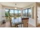 Bright dining area featuring large windows with a view and elegant furnishings at 835 S Osprey Ave # 310, Sarasota, FL 34236