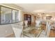 Elegant dining room showcasing modern decor with views to the lanai, kitchen and living room at 835 S Osprey Ave # 310, Sarasota, FL 34236