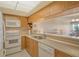 Efficient kitchen with light cabinets, modern appliances, and open view to the dining area at 835 S Osprey Ave # 310, Sarasota, FL 34236