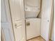A stacked washer and dryer unit tucked neatly behind closet doors offers convenience and space-saving functionality at 835 S Osprey Ave # 310, Sarasota, FL 34236