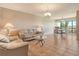 Open-concept living room featuring tile flooring and a dining area with beautiful natural lighting at 835 S Osprey Ave # 310, Sarasota, FL 34236