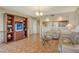 Inviting living room with tile flooring, built-in shelving, and comfortable seating, perfect for relaxation at 835 S Osprey Ave # 310, Sarasota, FL 34236