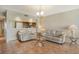 Cozy living room featuring comfortable couches, tile floors and decorative lighting at 835 S Osprey Ave # 310, Sarasota, FL 34236